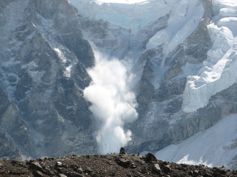 This photo shows an epic avalanche in action on Mt Everest. Huge amounts of snow tumble down the mountain at rapid speeds.