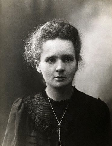 This is a black and white photo of Marie Curie, a scientist famous for being the first person to receive two Nobel Prizes as well as her extensive work on radioactivity.
