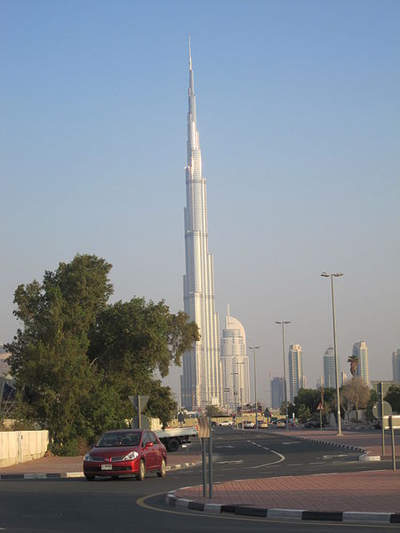 Burj Khalifa is the tallest building in the world, standing at an incredible 828 metres tall (2717 feet) it towers above Dubai, UAE. It includes 160 floors and was officially opened in 2010. This photo of Burj Khalifa is set against a blue sky and taken from a distance to make it possible to include the giant structure from top to bottom.