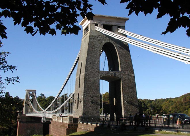 This photo shows a common type of bridge known as a suspension bridge. The Clifton Suspension Bridge stretches over the River Avon in Bristol, England. It was designed by a famous civil engineer named Isambard Kingdom Brunel.