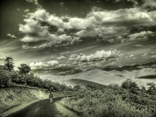 This surreal looking photo shows a pleasant day in the countryside with the major difference being the use of infrared in the photo, making the weather and overall image seem very unique.