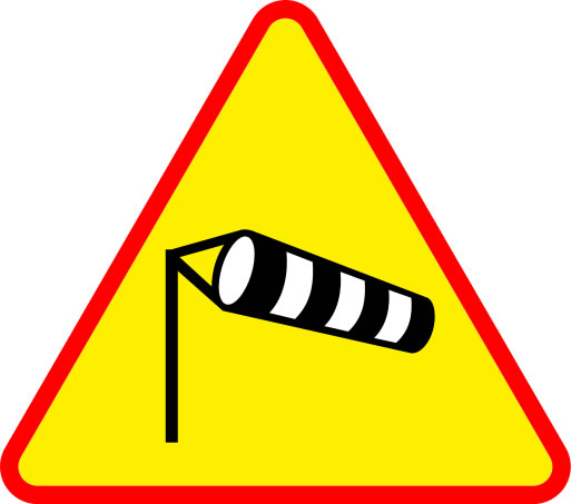 This wind warning sign shows a black and white wind sock blowing in strong winds.
