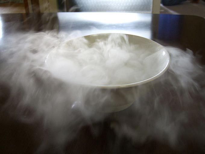 This photo shows the sublimation of dry ice to carbon dioxide as it comes into contact with water.