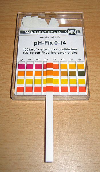 A photo of pH indicator paper, used to indicate the strength of various acids and bases.