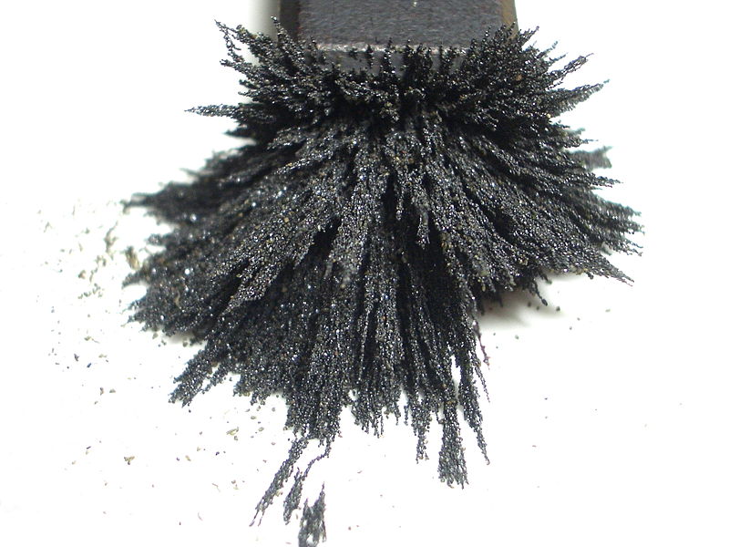This spectacular photo shows an interesting formation created by powder steel on a magnet. The powder steel forms spikes pointing in all directions away from the end of the magnet.