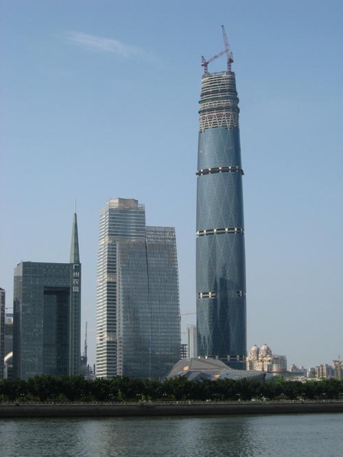 The Guangzhou West Tower in Guangzhou, China is one of the tallest buildings in the world. It measures an amazing 440 metres in height (1444 feet) and features 103 floors. This photo shows the tower in 2008, nearing the date of its final completion.