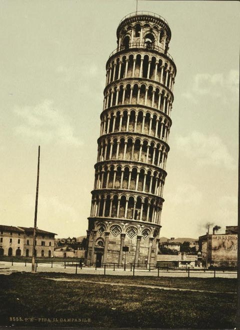 The Leaning Tower of Pisa in Italy is a world famous free standing bell tower that is visited by a large number of tourists every year. It was originally designed to stand up straight but began leaning over time. Work began on the Leaning Tower of Pisa back in 1173 and featured a lengthy building process. This old photo shows just how much the tower leans to one side.