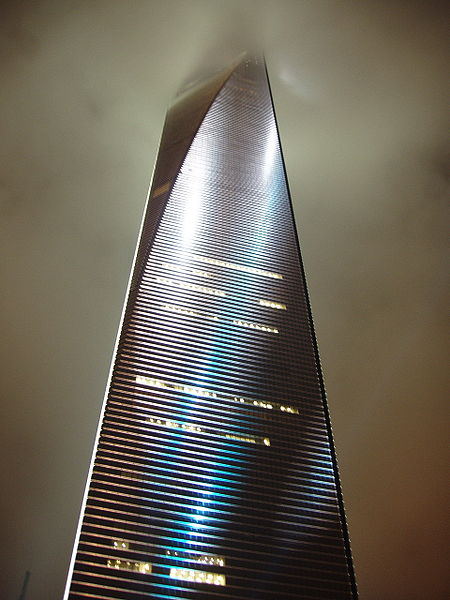 The Shanghai World Financial Center in China is one of the tallest buildings in the world. Built in 2008, it reaches 492 metres (1614 feet) in height and contains 101 floors. The skyscraper is used for a number of uses, from shopping malls, to hotels, offices and conference rooms. This image shows the building rising into the cloudy night sky.